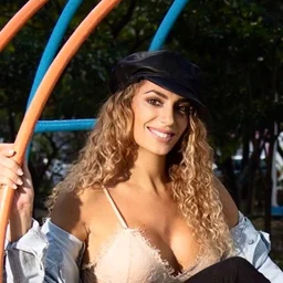 Mature woman wearing a flyer playing with fire